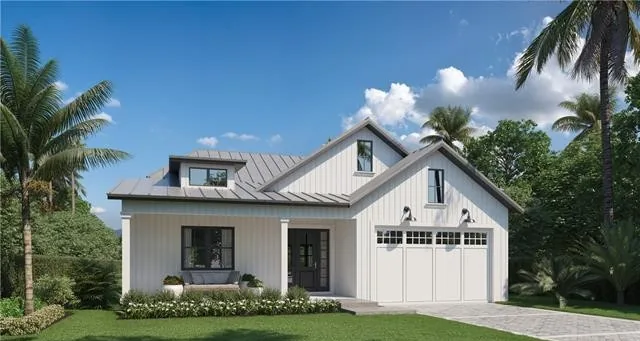 Classic Family Home in Naples, a coastal cottage style house with a metal roof